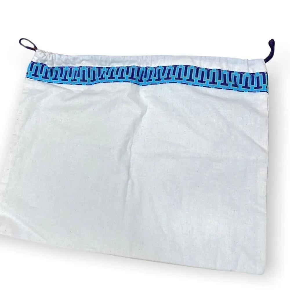 Tory Burch cream Dust bag with purple cord blue trim and gold signature hang tag